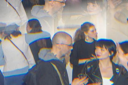 Photograph with a kaleidoscopic effect showing people at an art exhibition opening. Photograph with a kaleidoscopic effect showing people at an art exhibition opening.