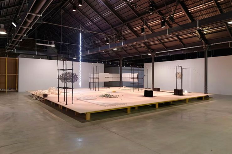 A warehouse with a bunch of art objects in it.