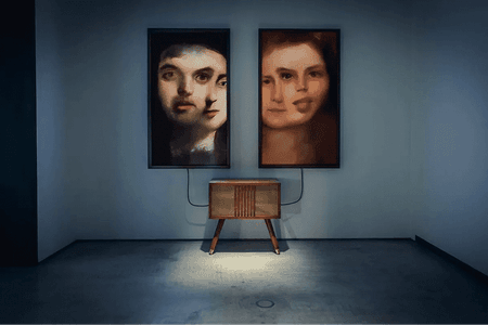 Two paintings with barely recognizable faces.