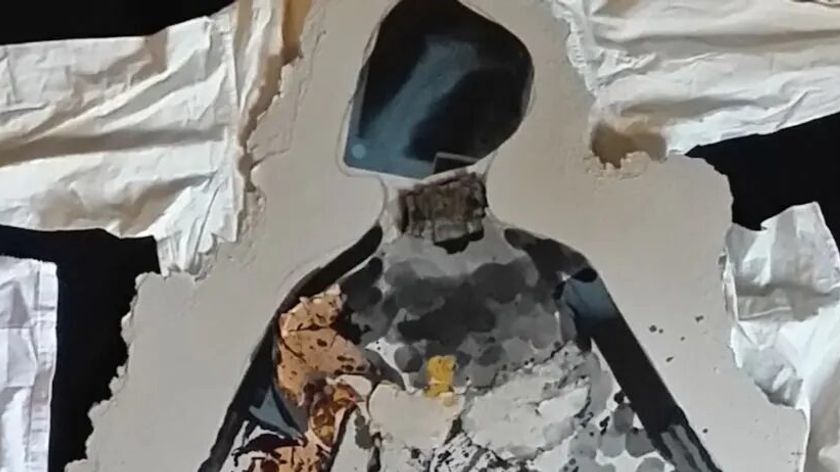 Collage composed of different textures forming a human figure.